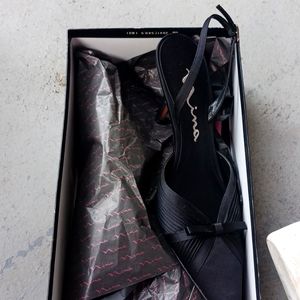 A pair of black shoes size 10  the name Nina